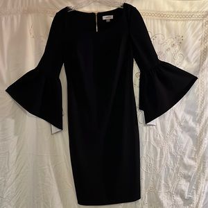 Vintage Calvin Klein size for black dress with puffy sleeves looks new